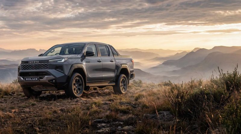 New-generation 2026 Toyota Hilux Legend 4x4 parked on a mountain ridge in South Africa at sunrise