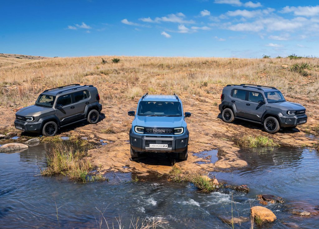 Three 2026 Toyota Land Cruiser FJ models crossing a river during the South African launch drive
